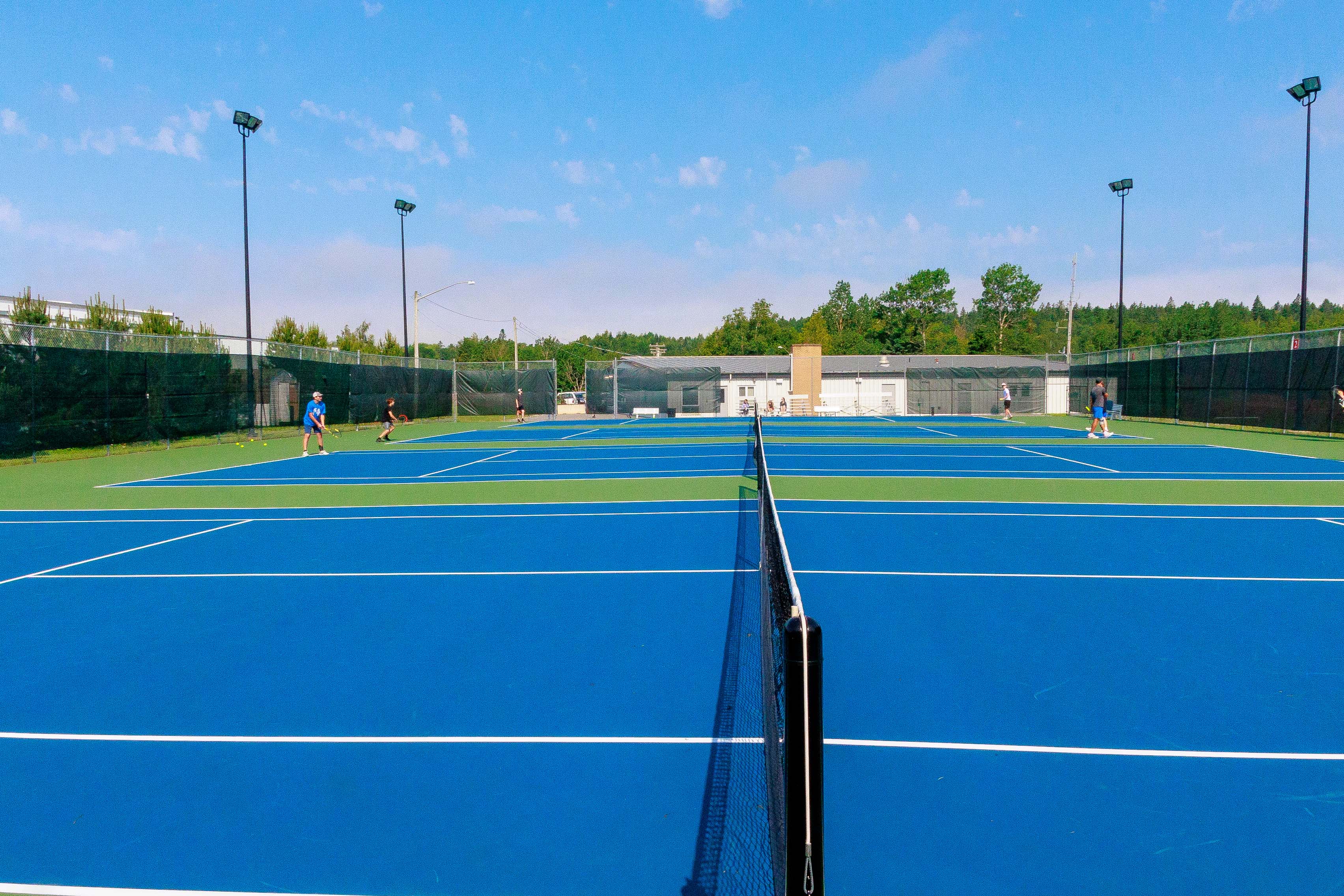 Closeup of tennis courts and nets.