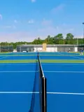 Closeup of tennis courts and nets.
