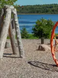 Wooden playground structure and sand area overlooking Ritchie Lake.