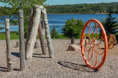 Wooden playground structure and sand area overlooking Ritchie Lake.